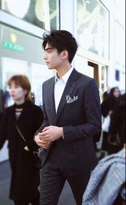 man in a semi formal suit and tie outfit