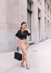 lady wearing black top and pink skirt