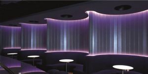 Sleek LED wall with round booth tables