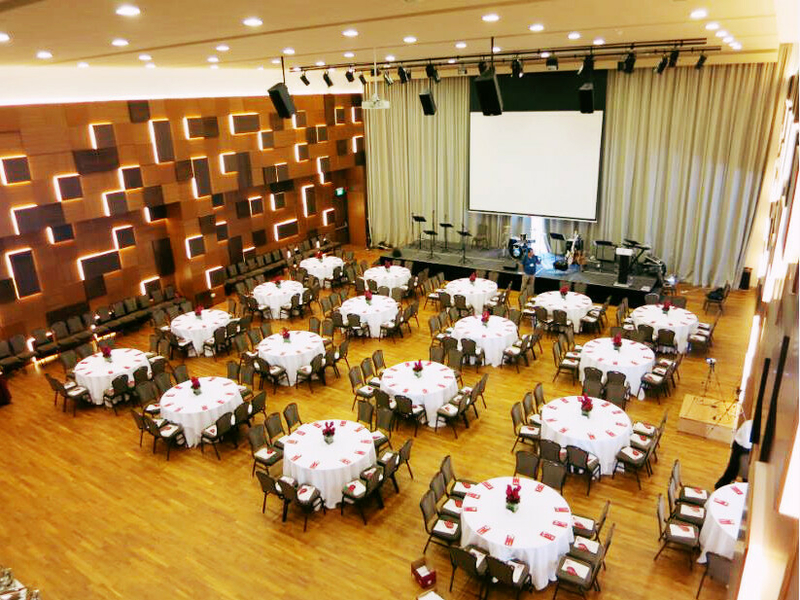 big hall with circular tables and chairs 