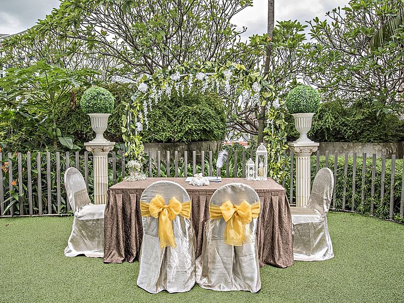 outdoor wedding reception set up with tables and chairs